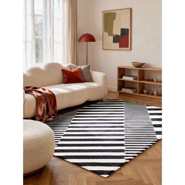 Melnbalts ar rokām darināts vilnas paklājs 200x290 cm Stryve Flux – Elle Decoration-image-1