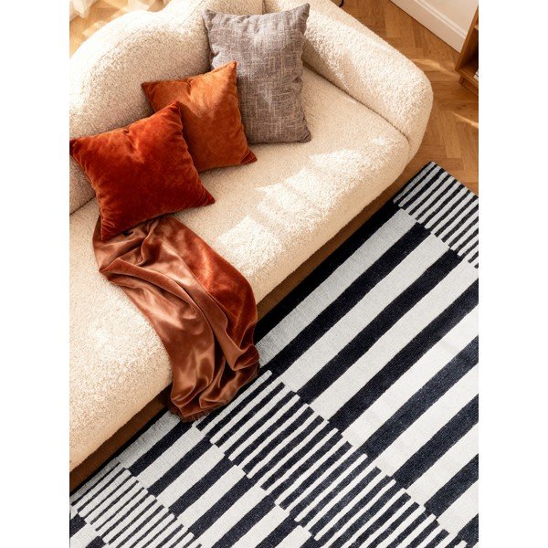 Melnbalts ar rokām darināts vilnas paklājs 120x180 cm Stryve Pulse – Elle Decoration-image-2
