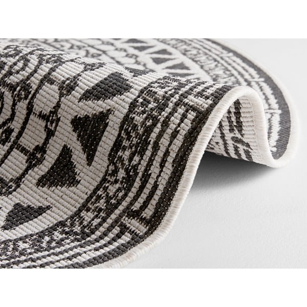 Melns un krēmkrāsas āra paklājs NORTHRUGS Coron, ø 140 cm-image-1